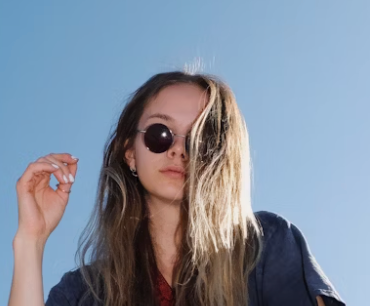 Blonde woman in sunglasses outdoors